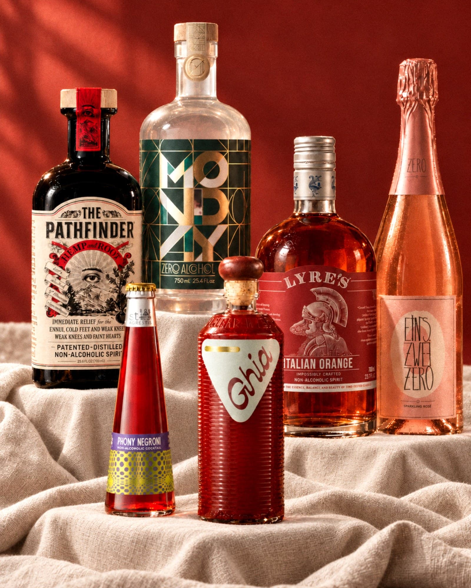 Non-alcoholic bottles: Pathfinder, Monday gin, Lyre's Italian Orange, Leitz sparkling rosé, Ghia and St. Agrestis Phony Negroni